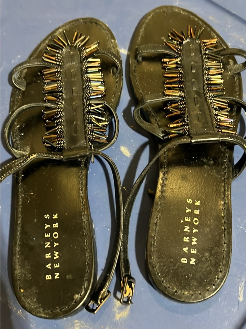 Barney’s New York buckle sandals with beaded accents.